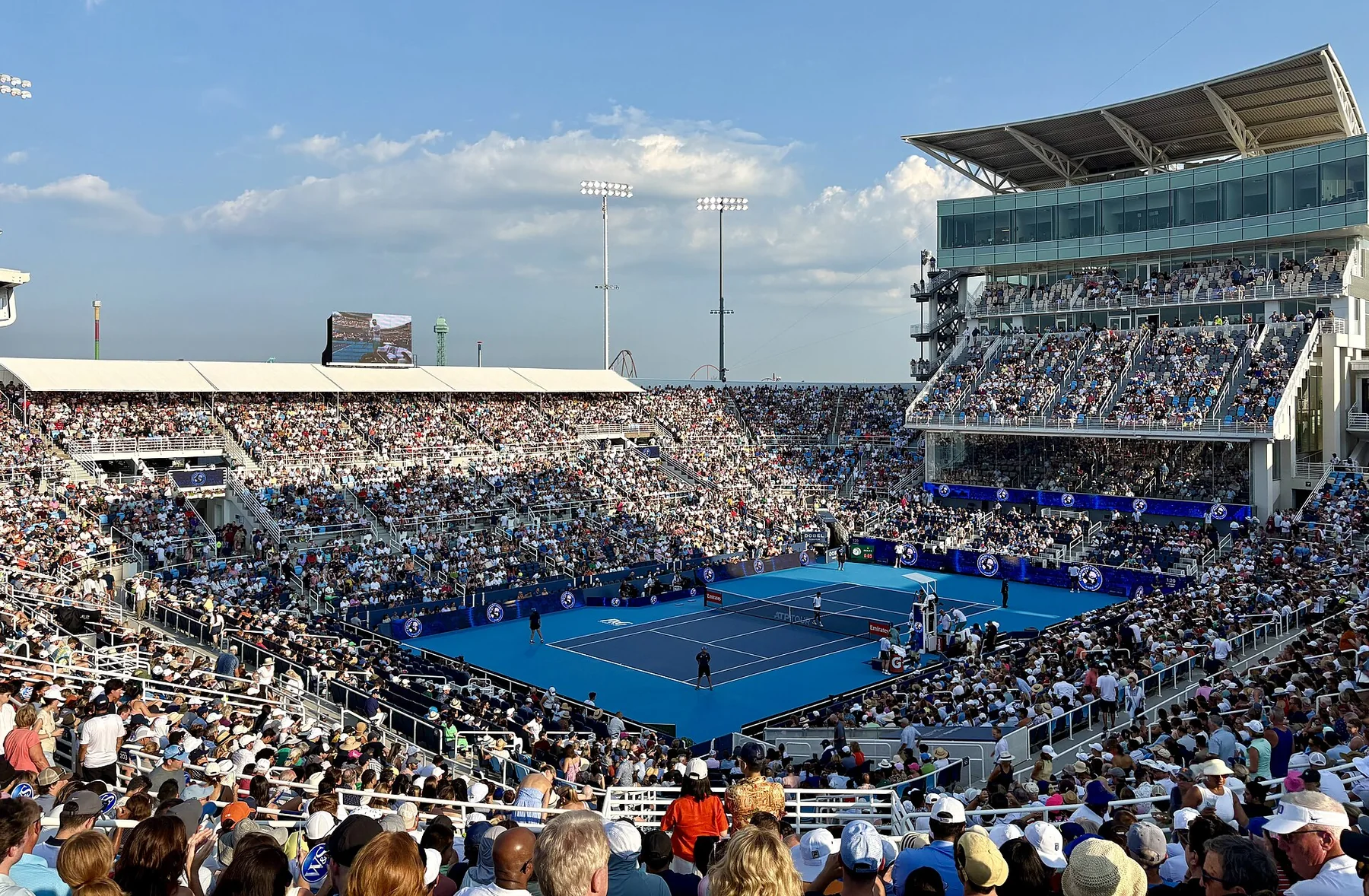 Carlos Alcaraz striking a forehand during a hard-court match