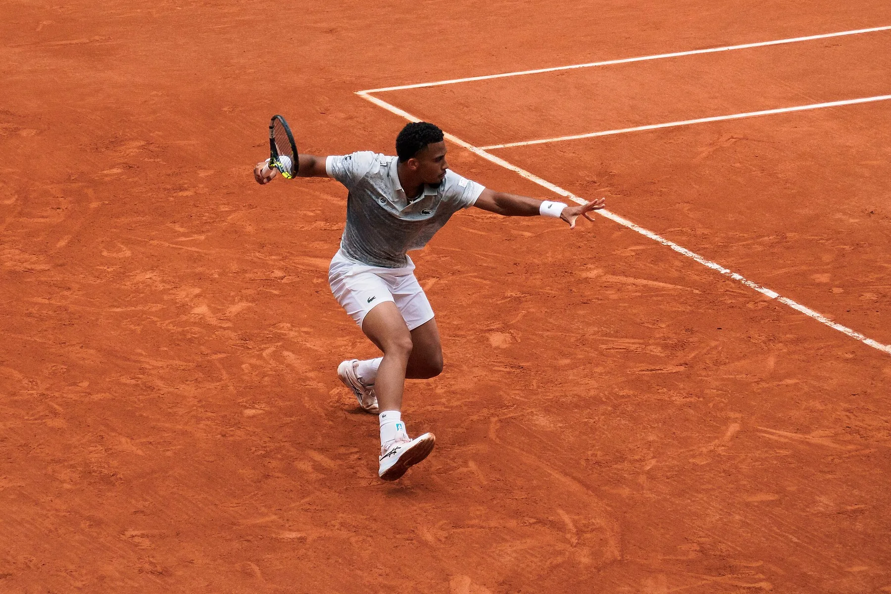 Arthur Fils hitting a forehand during the 2025 French Open