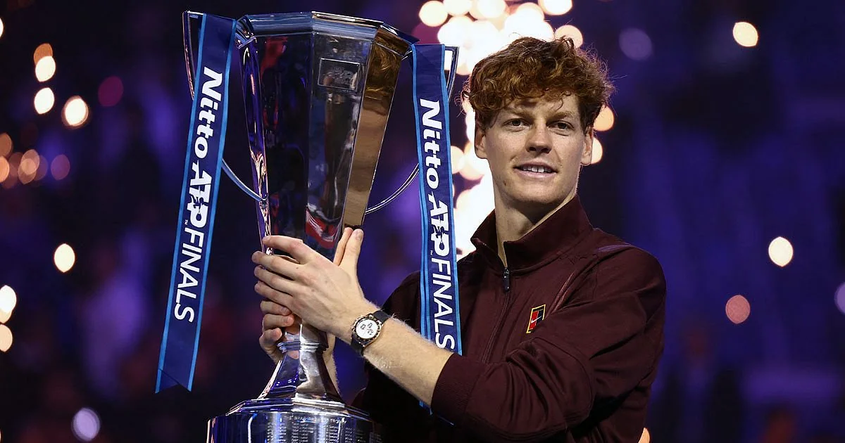 Jannik Sinner holding the Nitto ATP Finals trophy after his 2025 title