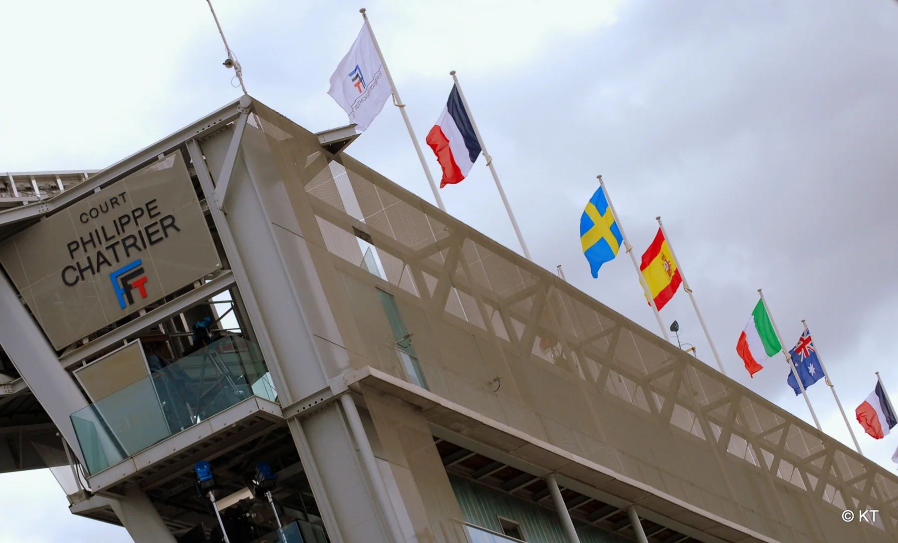 Court Philippe-Chatrier exterior at Roland-Garros with international flags